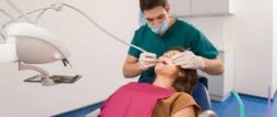 Dental Hygienist Cleaning Teeth